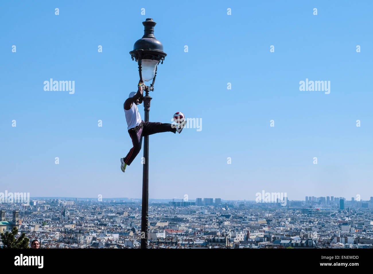 The street artist and football player and freestyler IYA TRAORE in Montmartre, Paris Stock Photo
