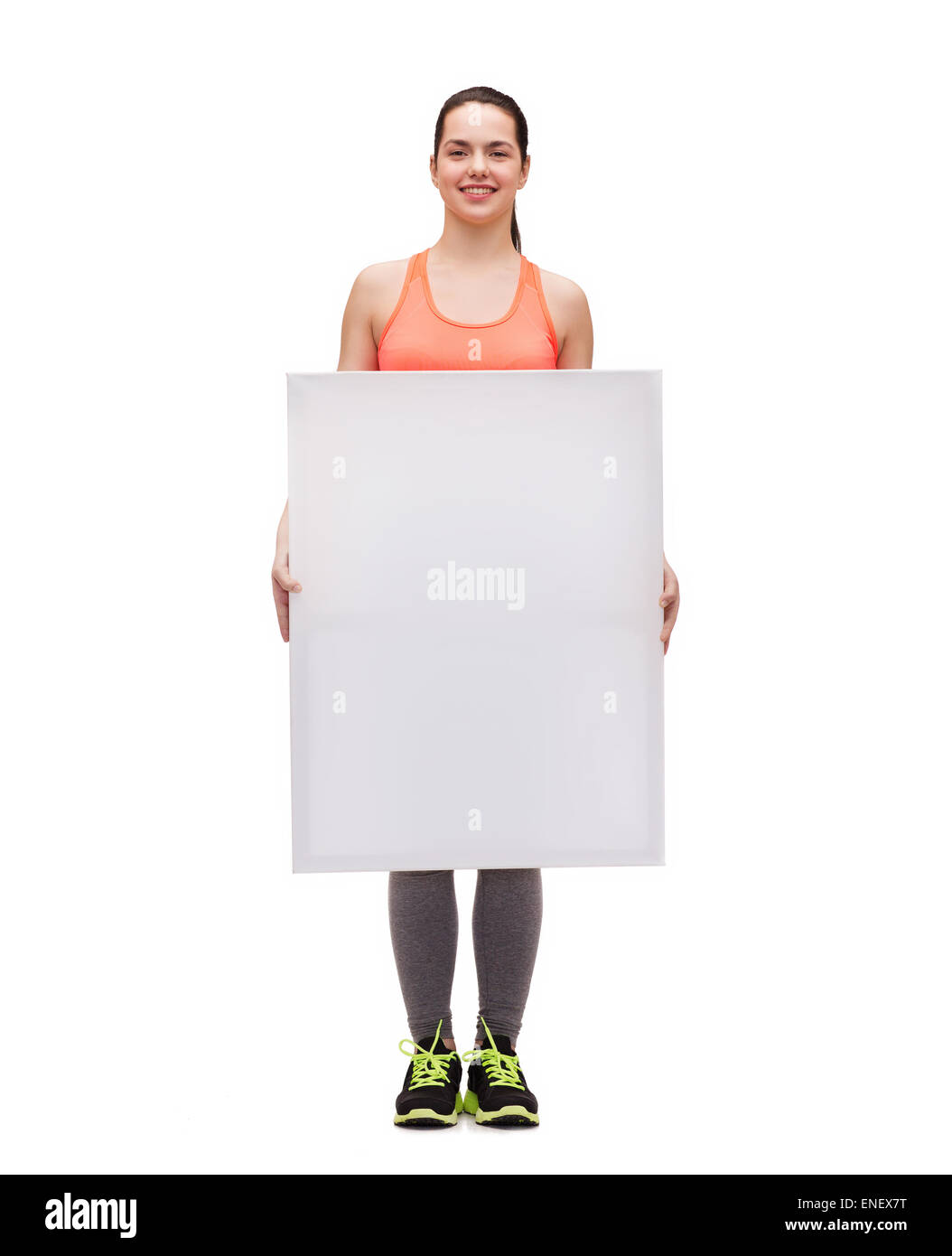 teenage girl in sportswear with white board Stock Photo