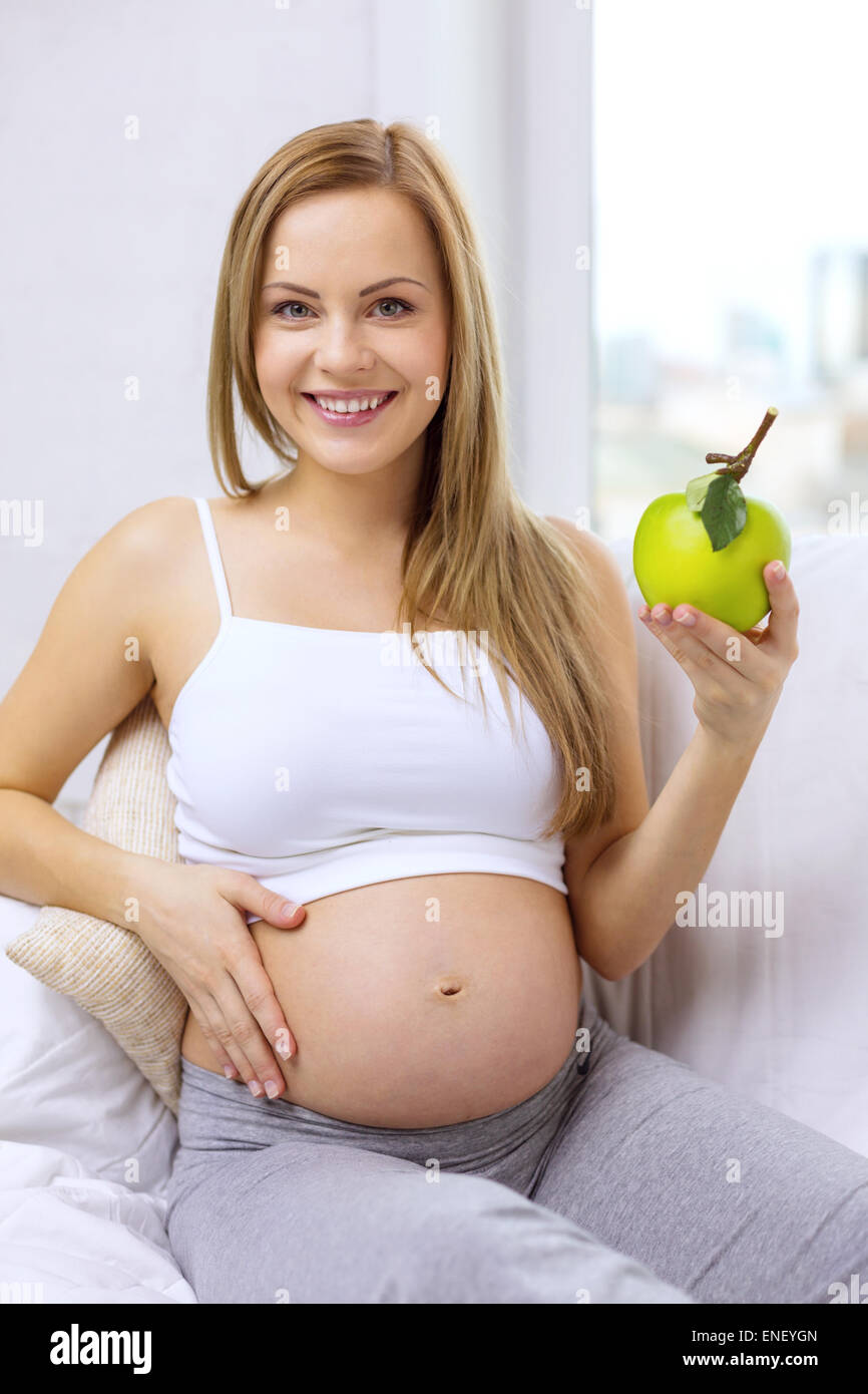 happy pregnant woman with fresh green apple Stock Photo Alamy
