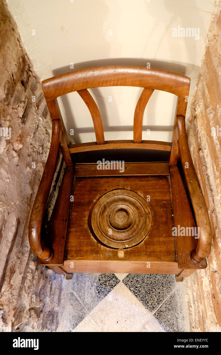 Old French wooden chair and toilet Stock Photo
