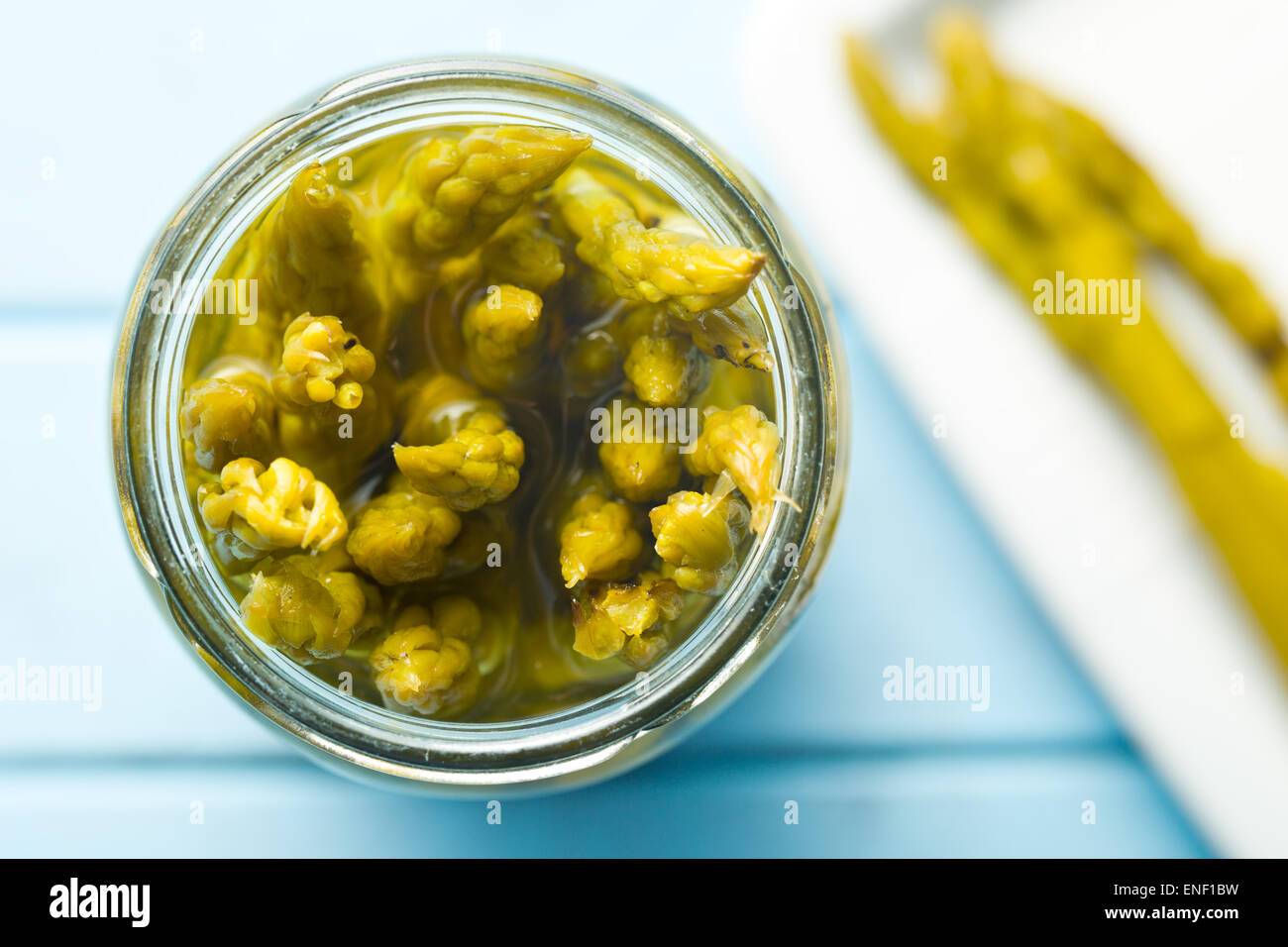 pickled asparagus on kitchen table Stock Photo