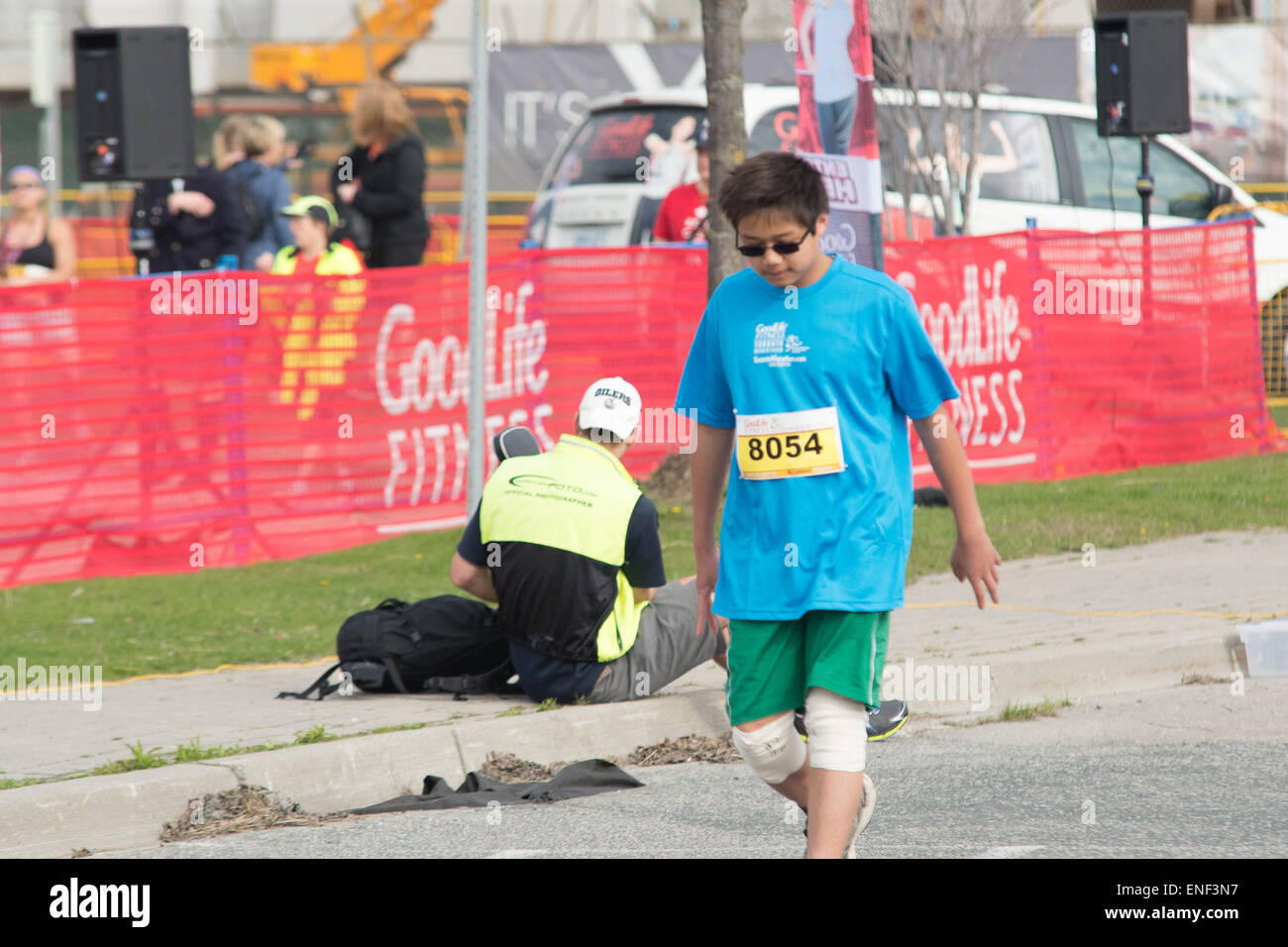 Toronto, Canada. 3rd May, 2015. Bib number 8054 walking over the finish line. Credit:  NISARGMEDIA/Alamy Live News Stock Photo