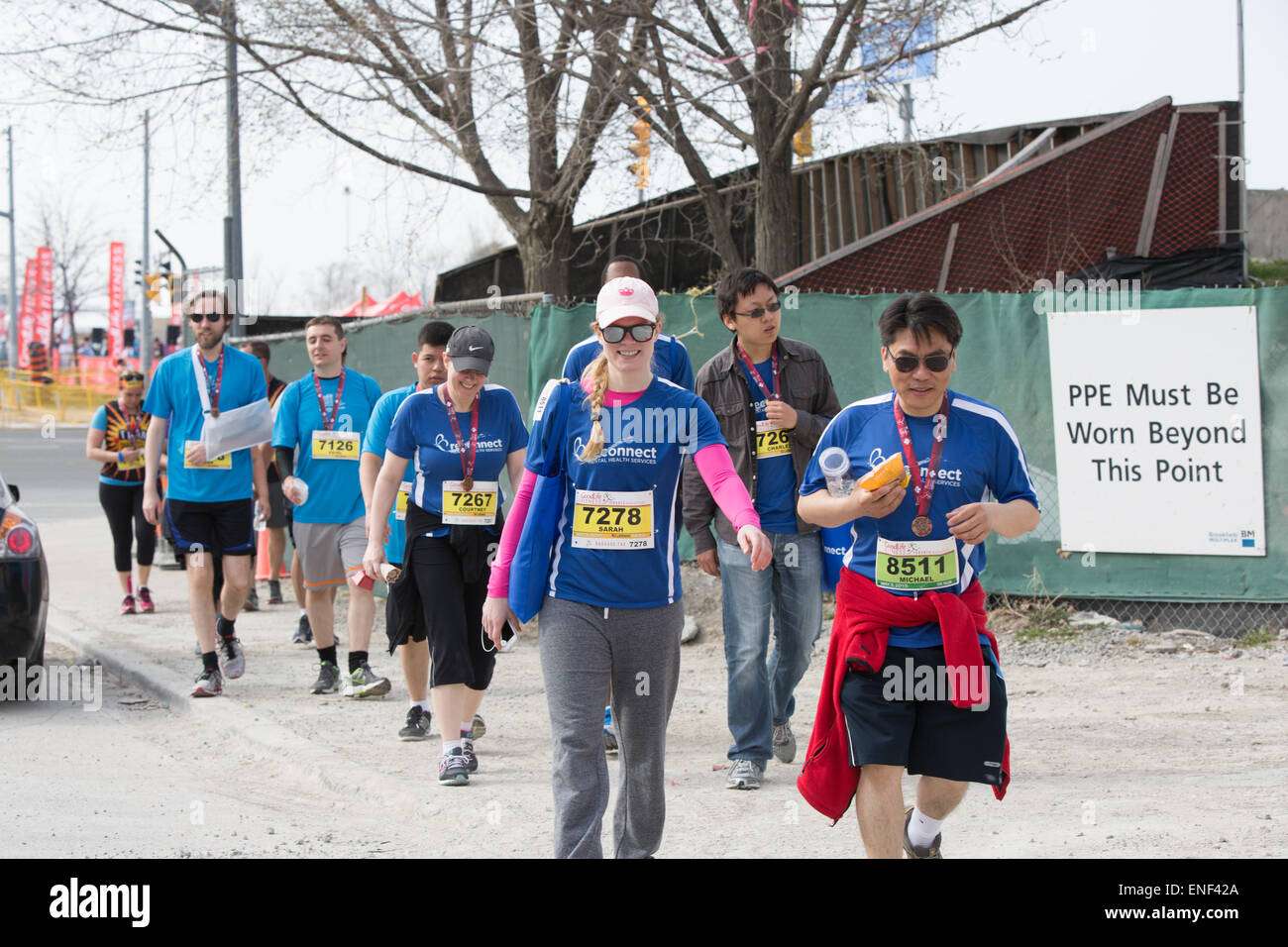 Toronto, Canada. 3rd May, 2015. Runners walking by, after finishing the race in Toronto Marathon