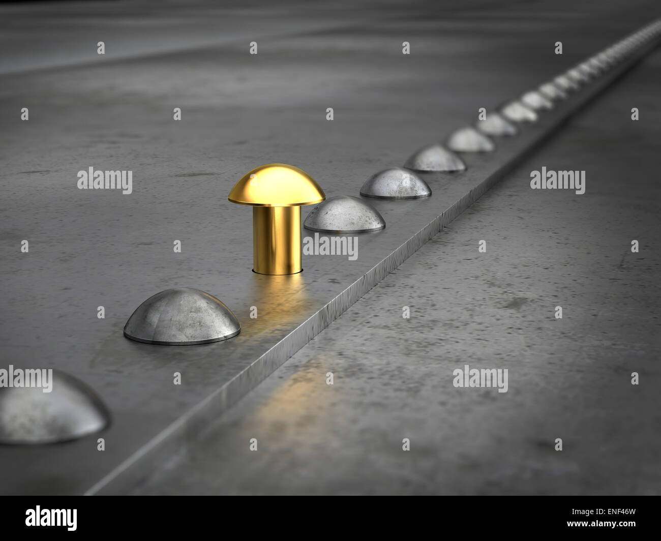 Row of rivets on the metal grunge background. One golden rivet in the row. Leadership concept. Stock Photo