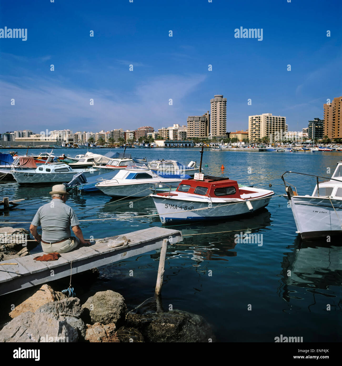 Fuengirola, Costa del Sol, Malaga Province, Andalusia, southern Spain.  View across fishing harbour to town. Stock Photo