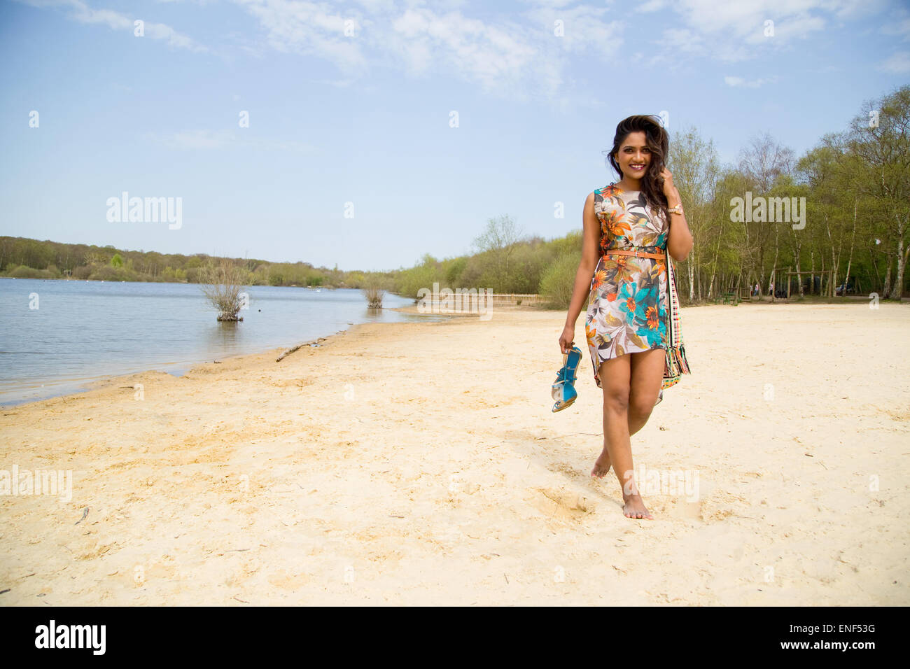 young woman walking along the river bank Stock Photo - Alamy