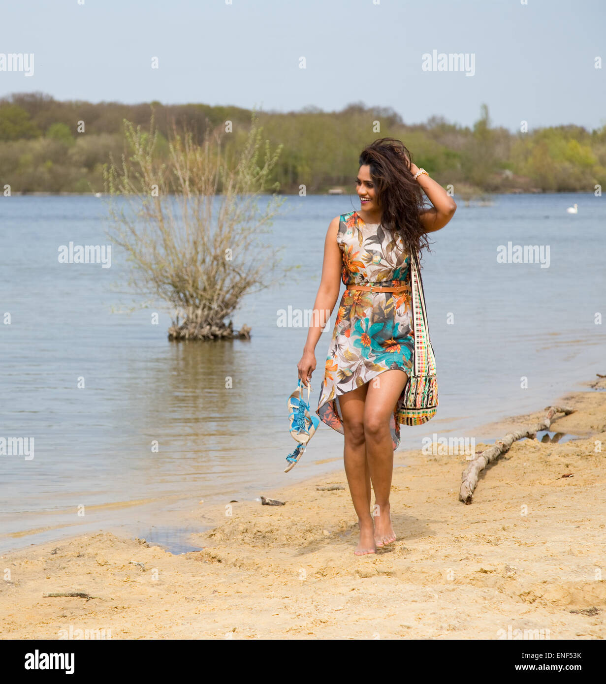 young woman walking along the river bank Stock Photo - Alamy