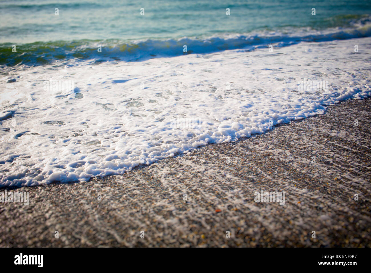 Waves breaking on seashore. Stock Photo