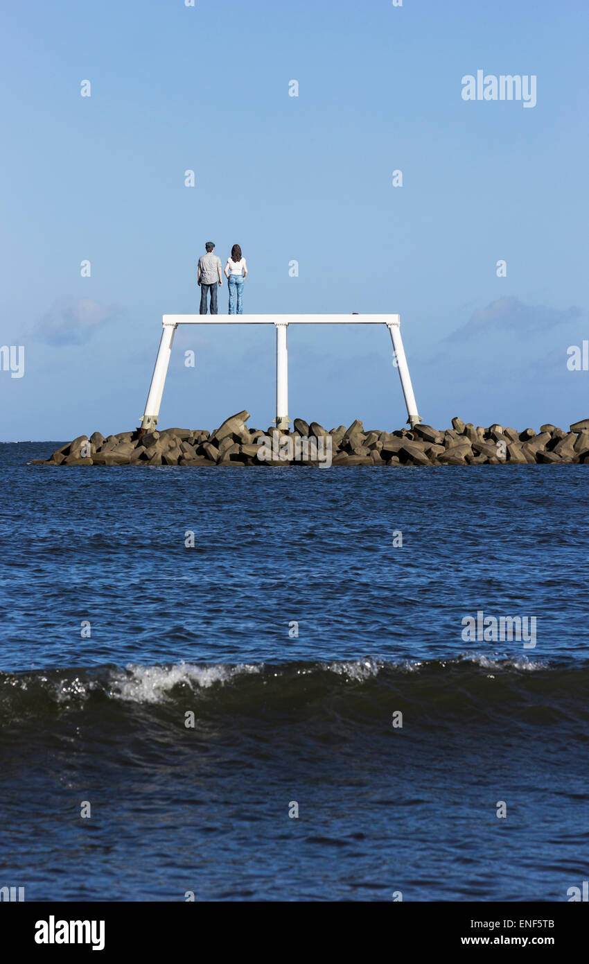Sculptures in the sea. Public art at Newbiggin by the Sea with waves