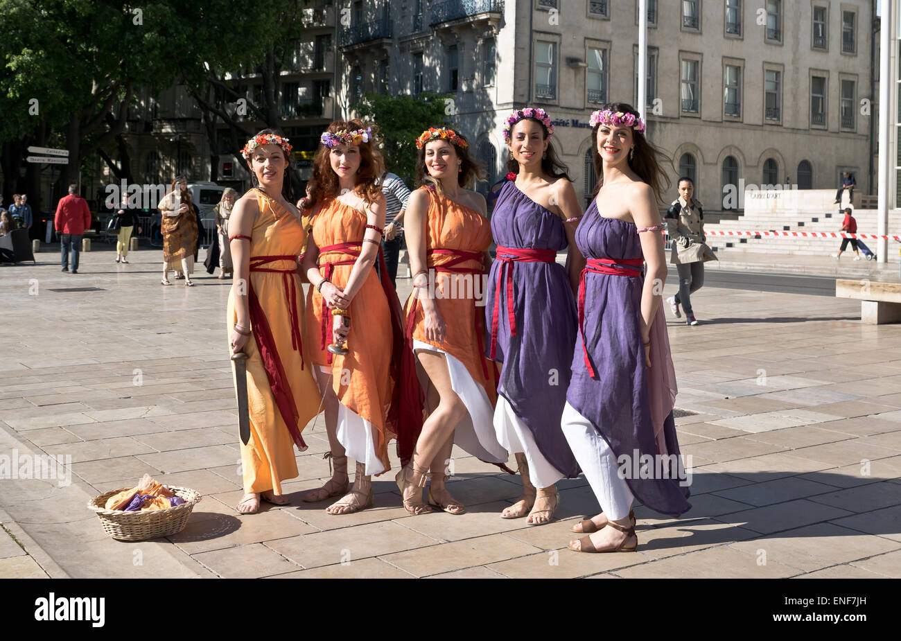 Pretty girls pose for pictures in the French city of Nimes for the Roman re-enactment games. Stock Photo