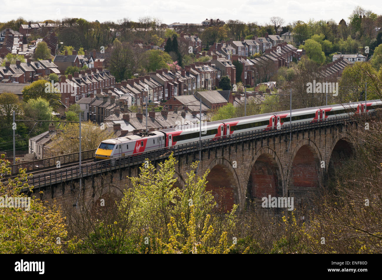 Virgin East Coast mainline express passenger electric train crossing Durham viaduct, north east England UK Stock Photo