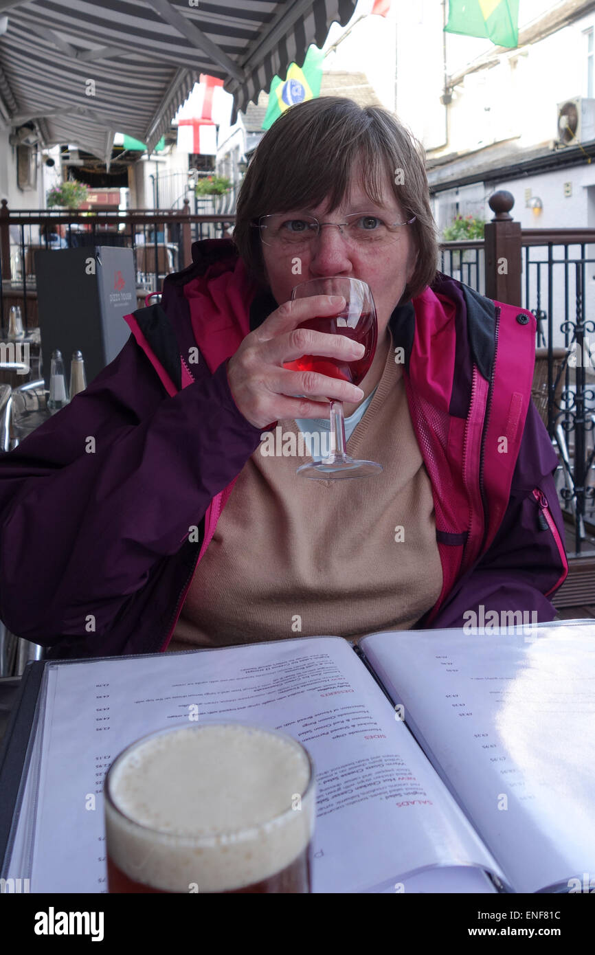 Woman drinking wine, outside dining, Keswick Stock Photo