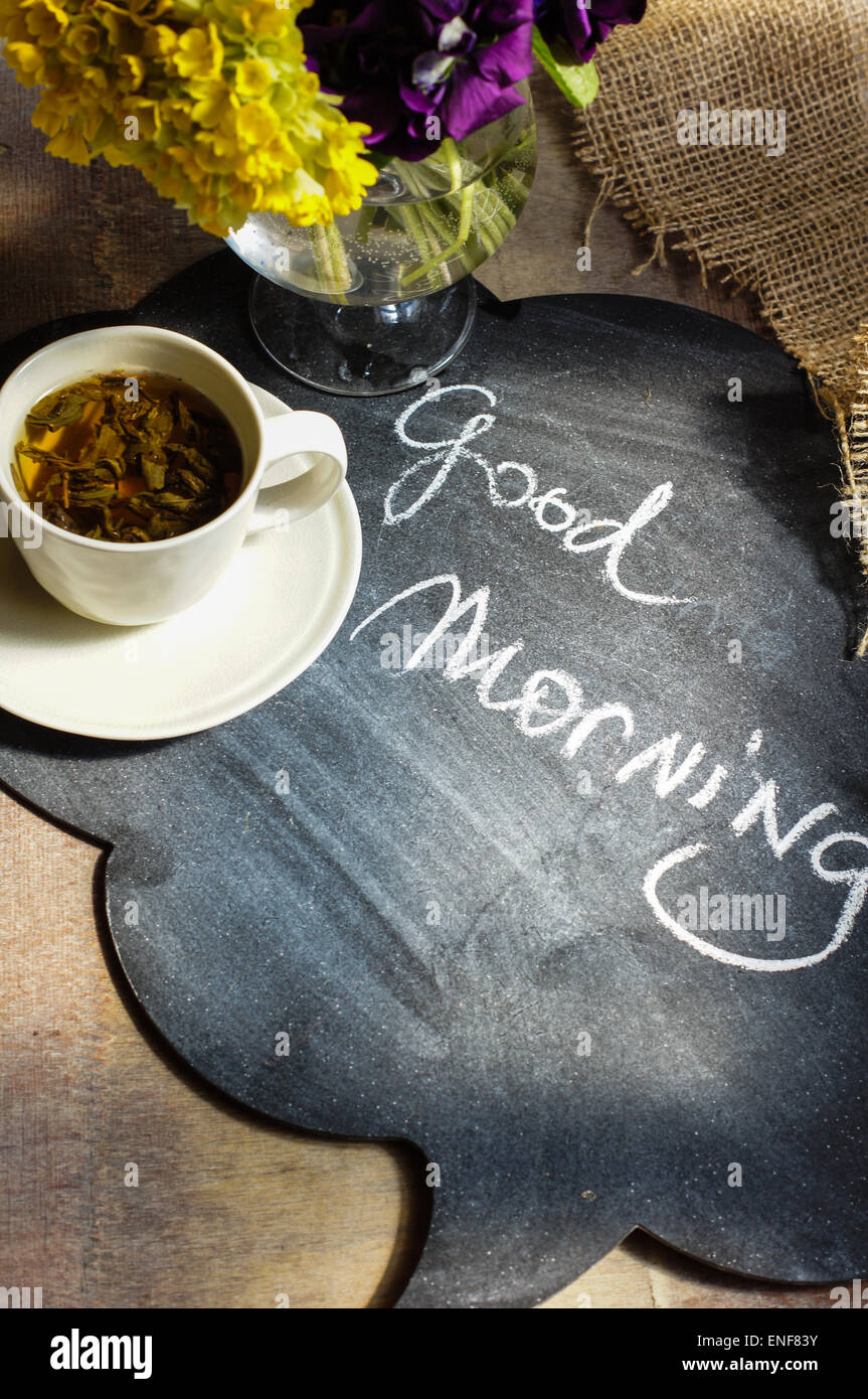 Cup o tea and spring flowers with good morning note Stock Photo ...