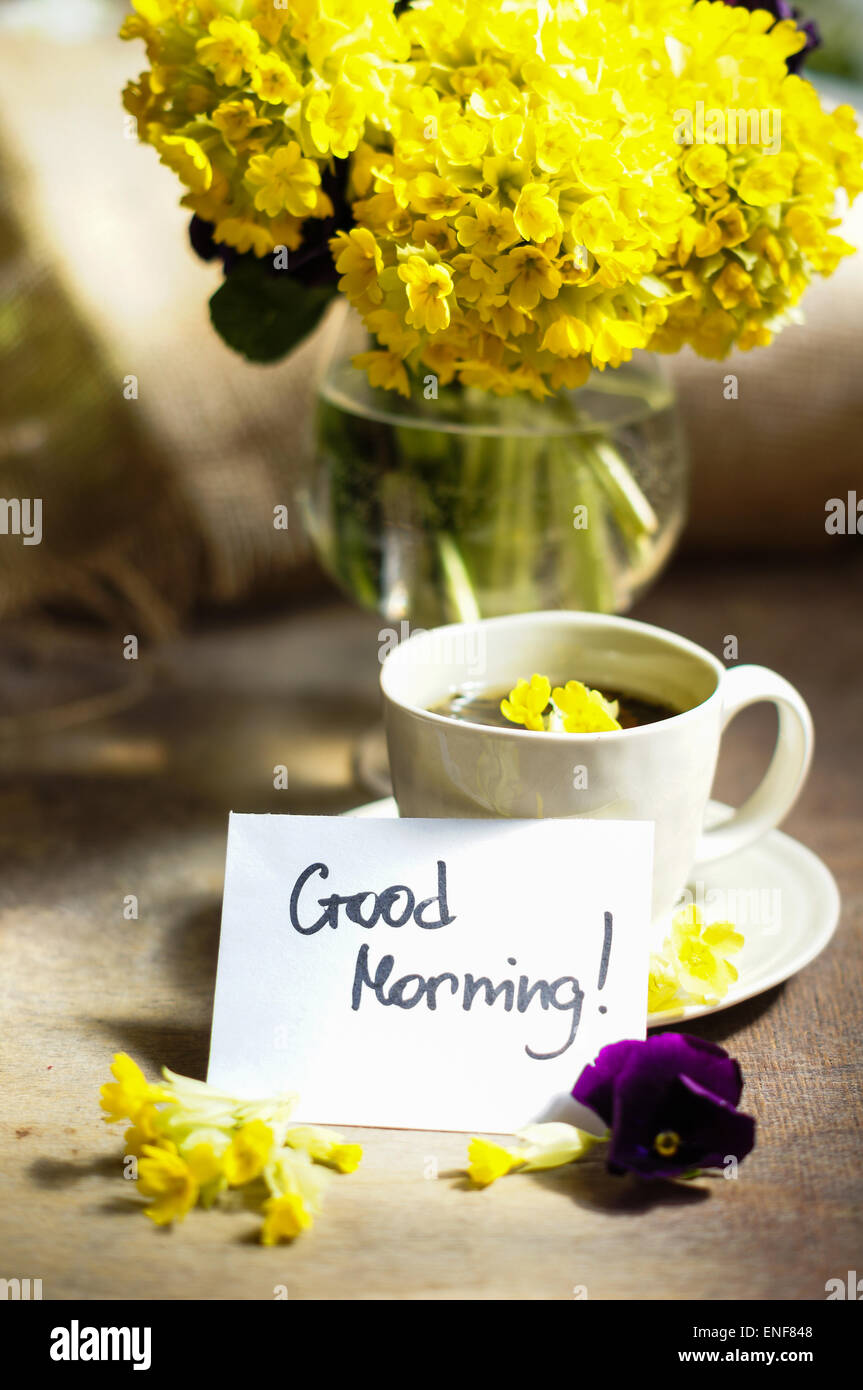 Cup o tea and spring flowers with good morning note Stock Photo