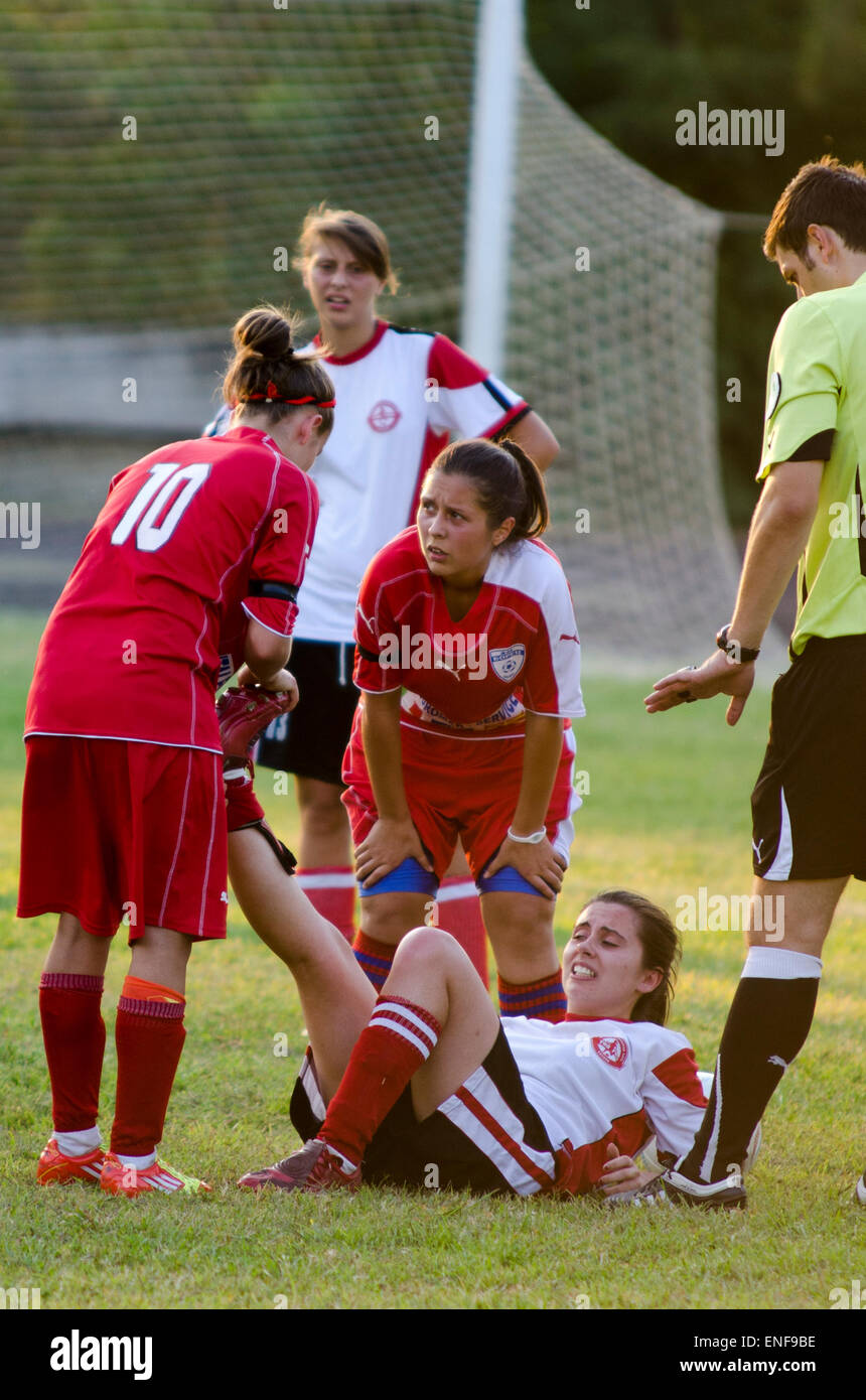 Football player is giving first aid on opponent player Stock Photo Alamy