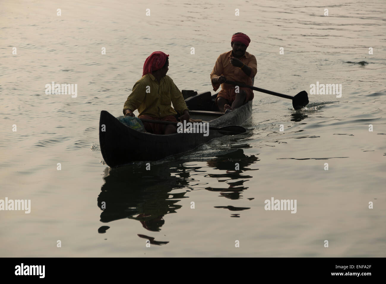 Fishermen in their boats in Vembanad Lake, Cochin, Kerala, India Stock Photo