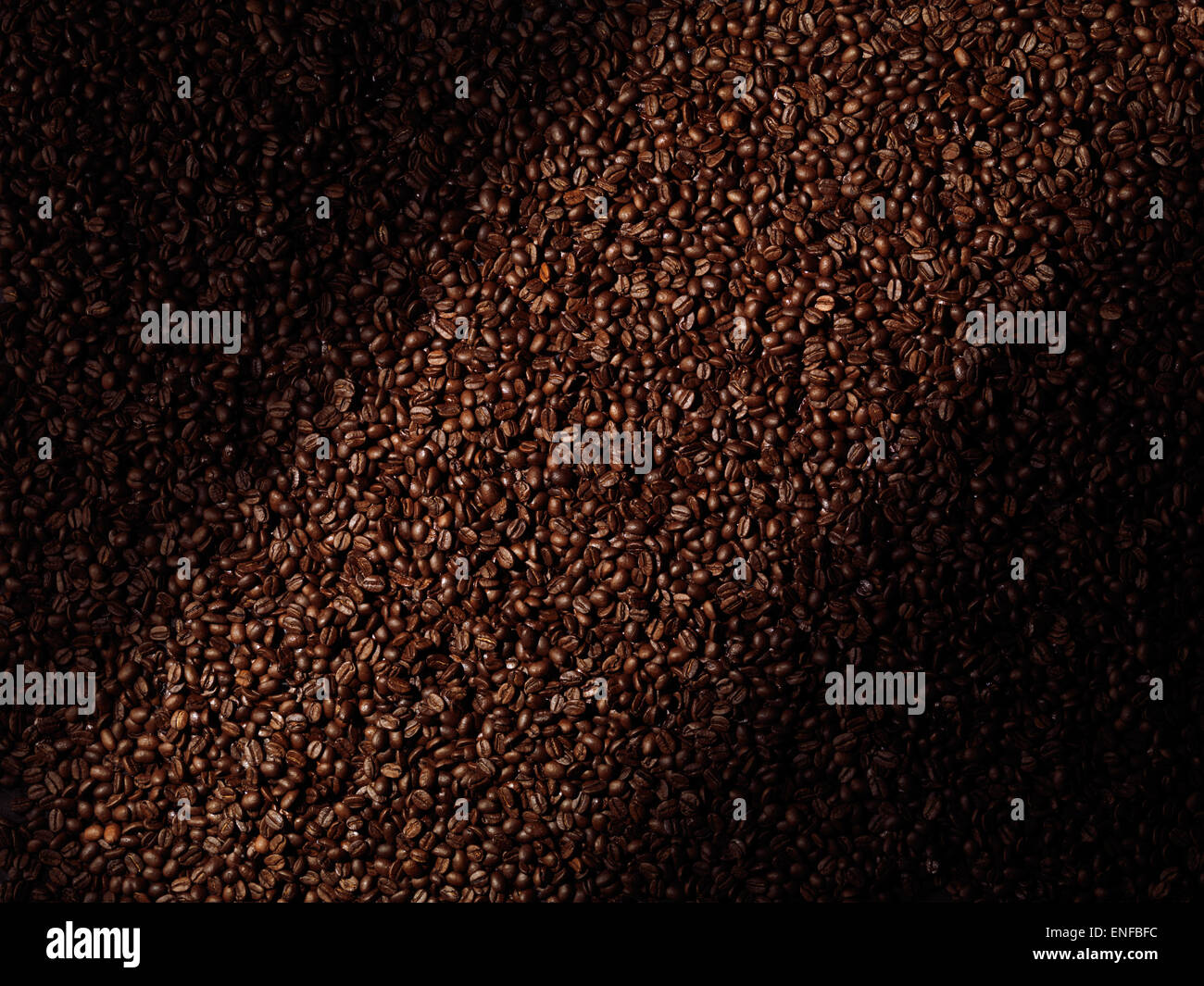 Roasted arabica coffee beans abstract artistic background texture Stock Photo