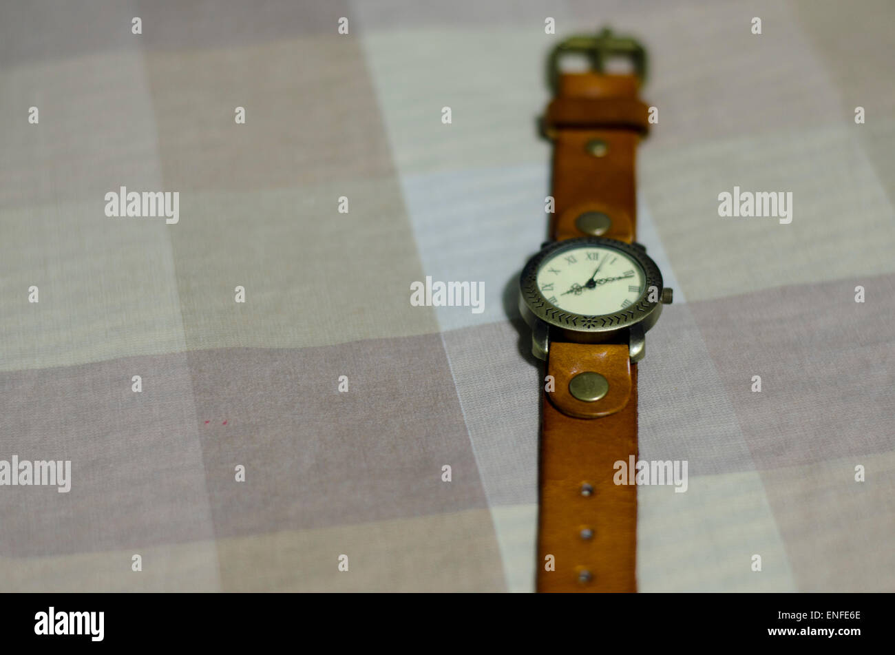 classic Wristwatch on brown tone color background Stock Photo