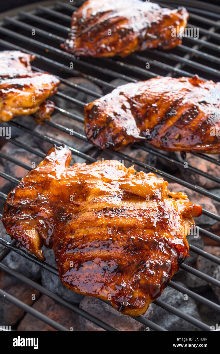 Grilled boneless chicken thighs marinated and basted in a mixture of