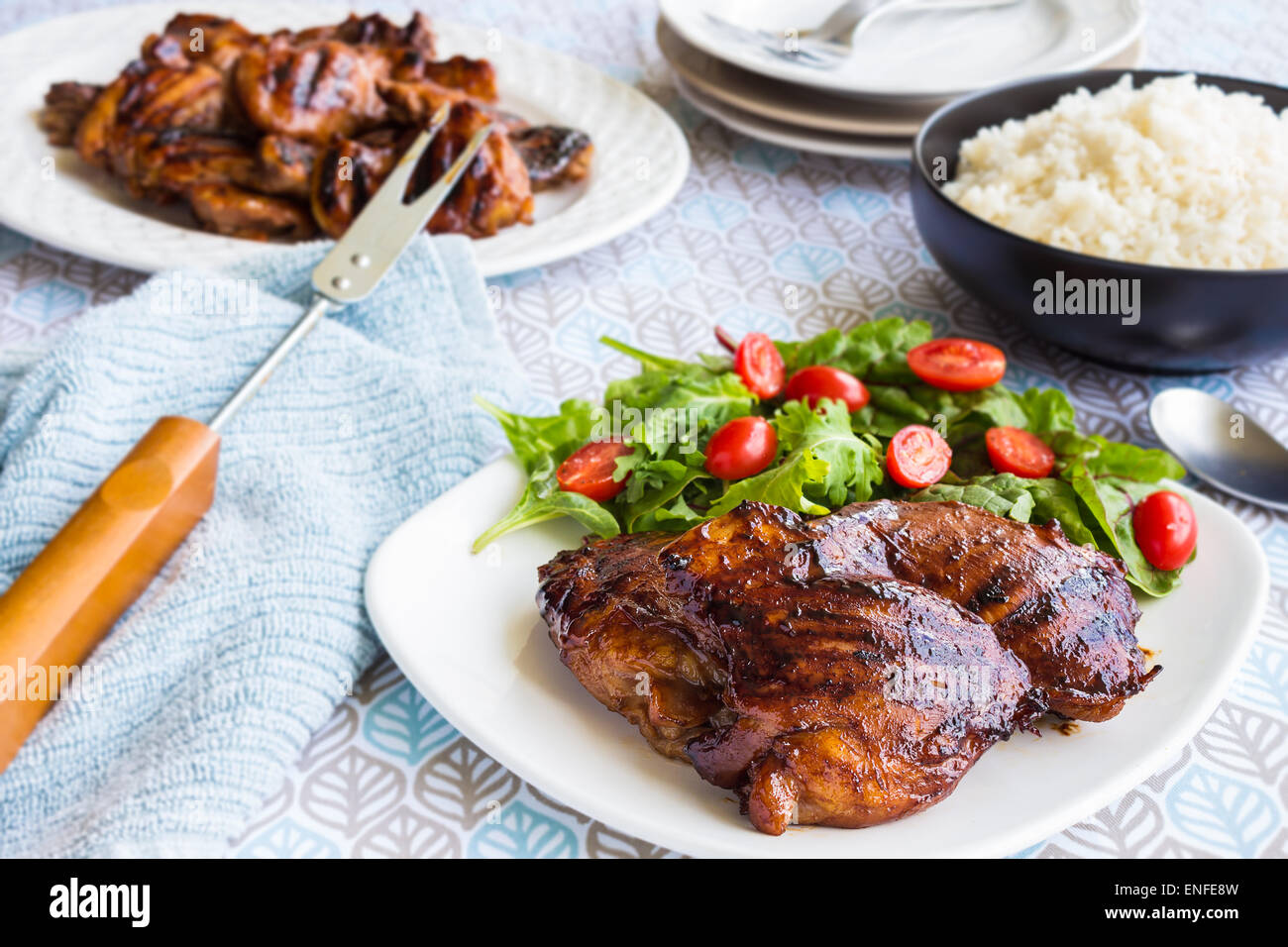 Grilled boneless chicken thighs marinated and basted in a mixture of