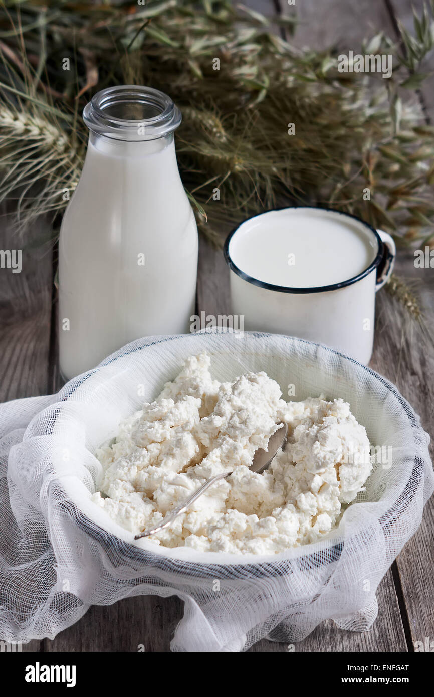 Milk Cottage Cheese Wheat And Oat Grains On Old Wooden