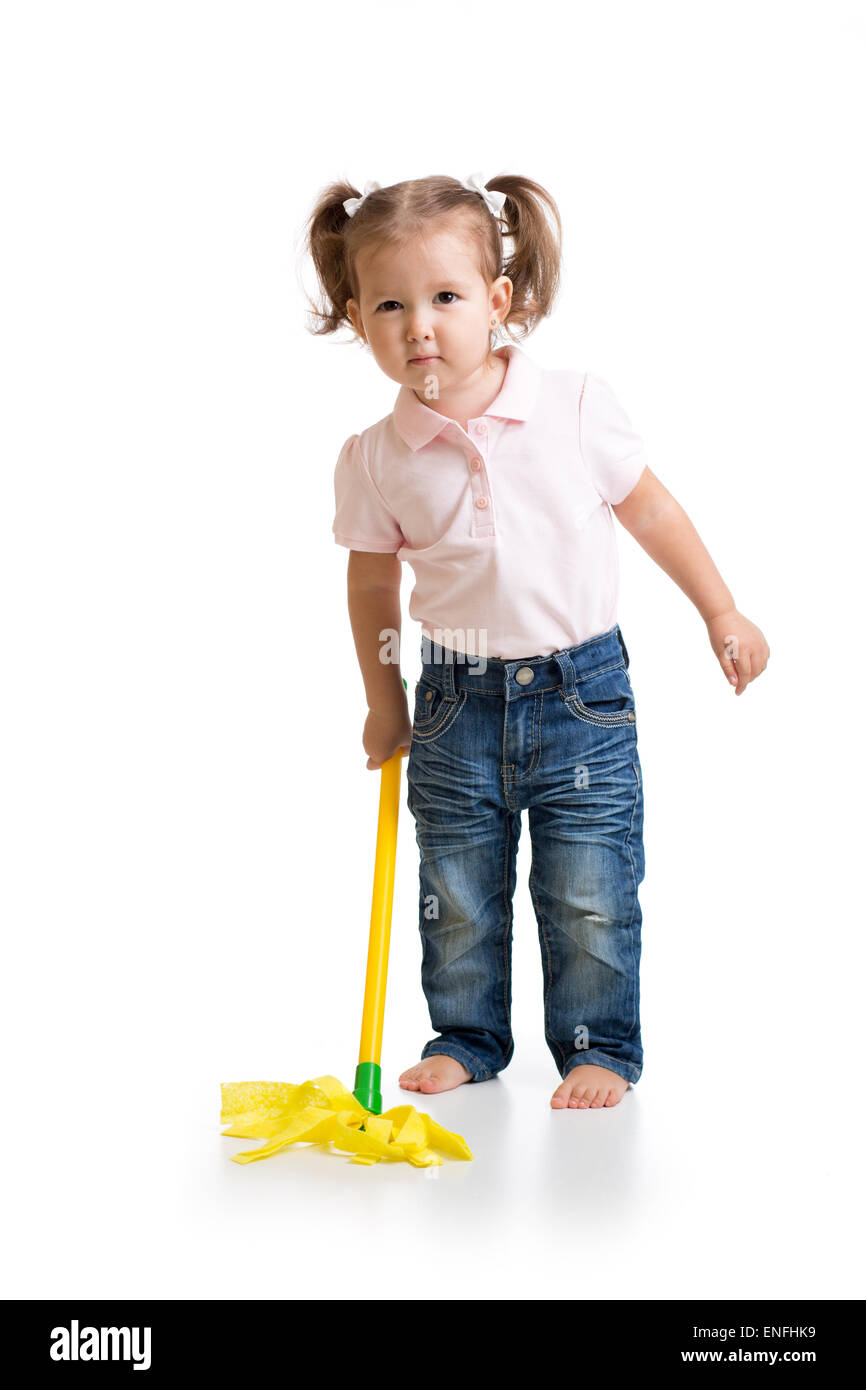 Little child girl doing her chore of mopping the floor Stock Photo