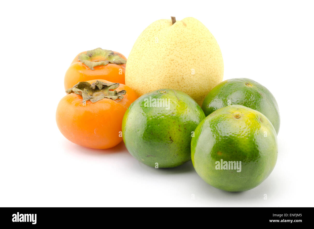 chinese pear persimon and green orange isolated on white background Stock Photo