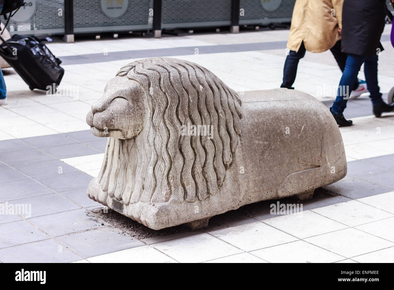Stone figure of a lion on Drottninggatan street, Stockholm Stock Photo