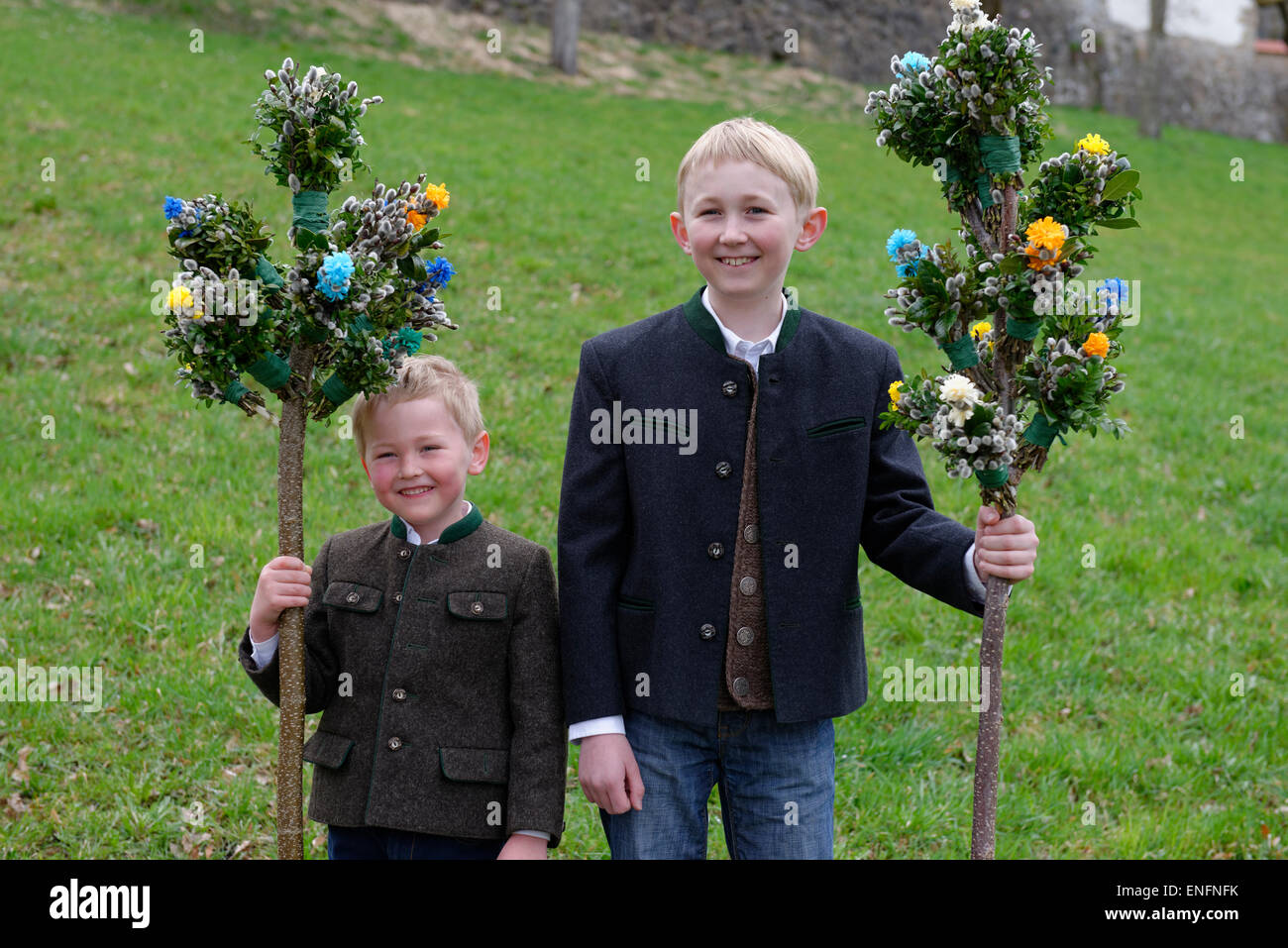 Two boys with palm branches, blessing of the palms, Palm Sunday, Holy Week, Easter, Bad Heilbrunn, Upper Bavaria, Bavaria Stock Photo