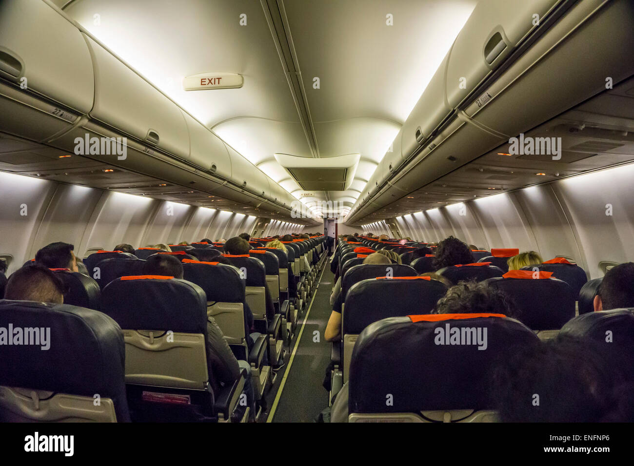 Commercial airliner interior economy class cabin Stock Photo