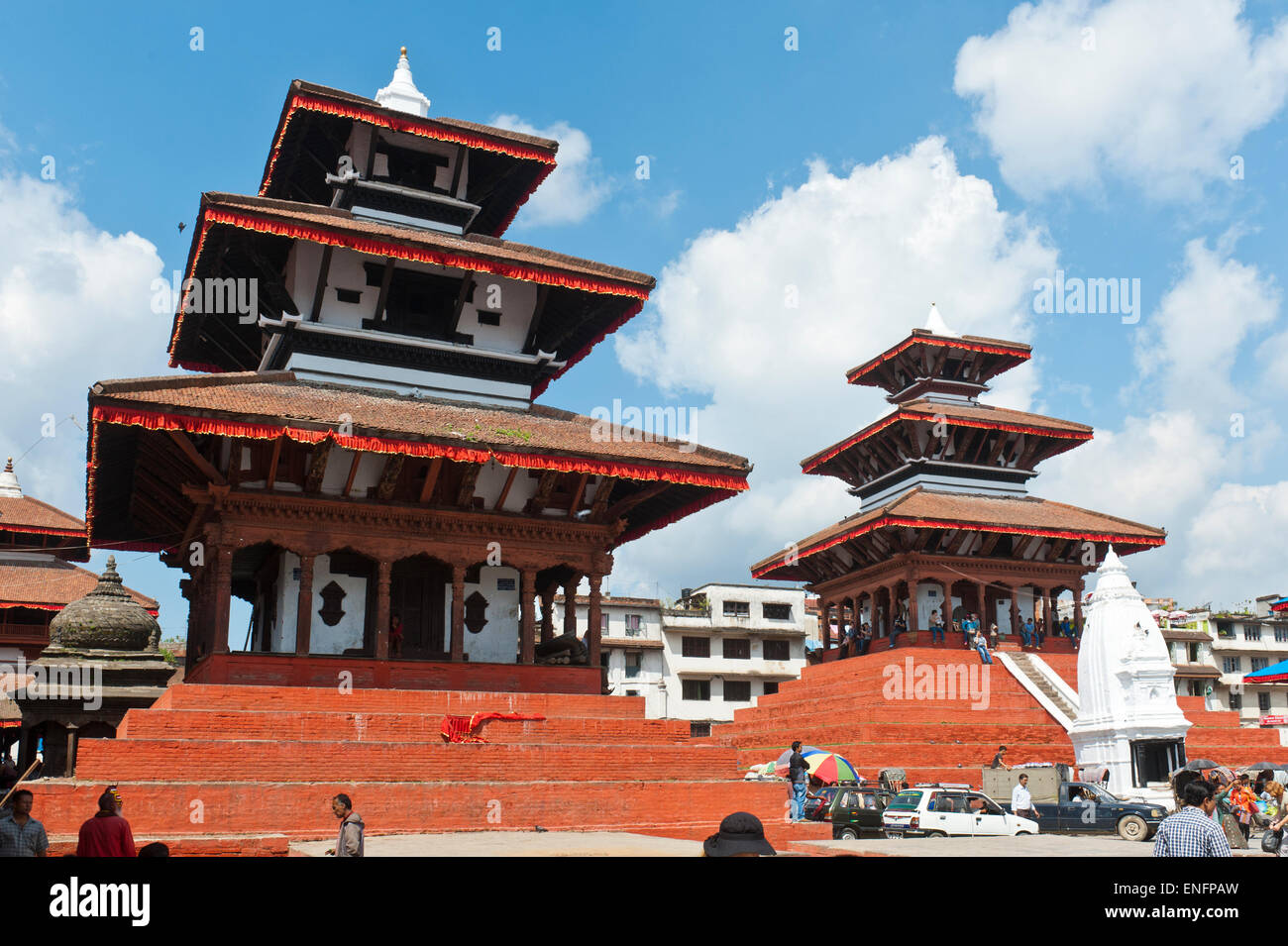 Three-storey Nepalese pagoda, architecture of the Newar, right Shiva temple Maju Deval, white Shikhara, left Garuda Temple Stock Photo