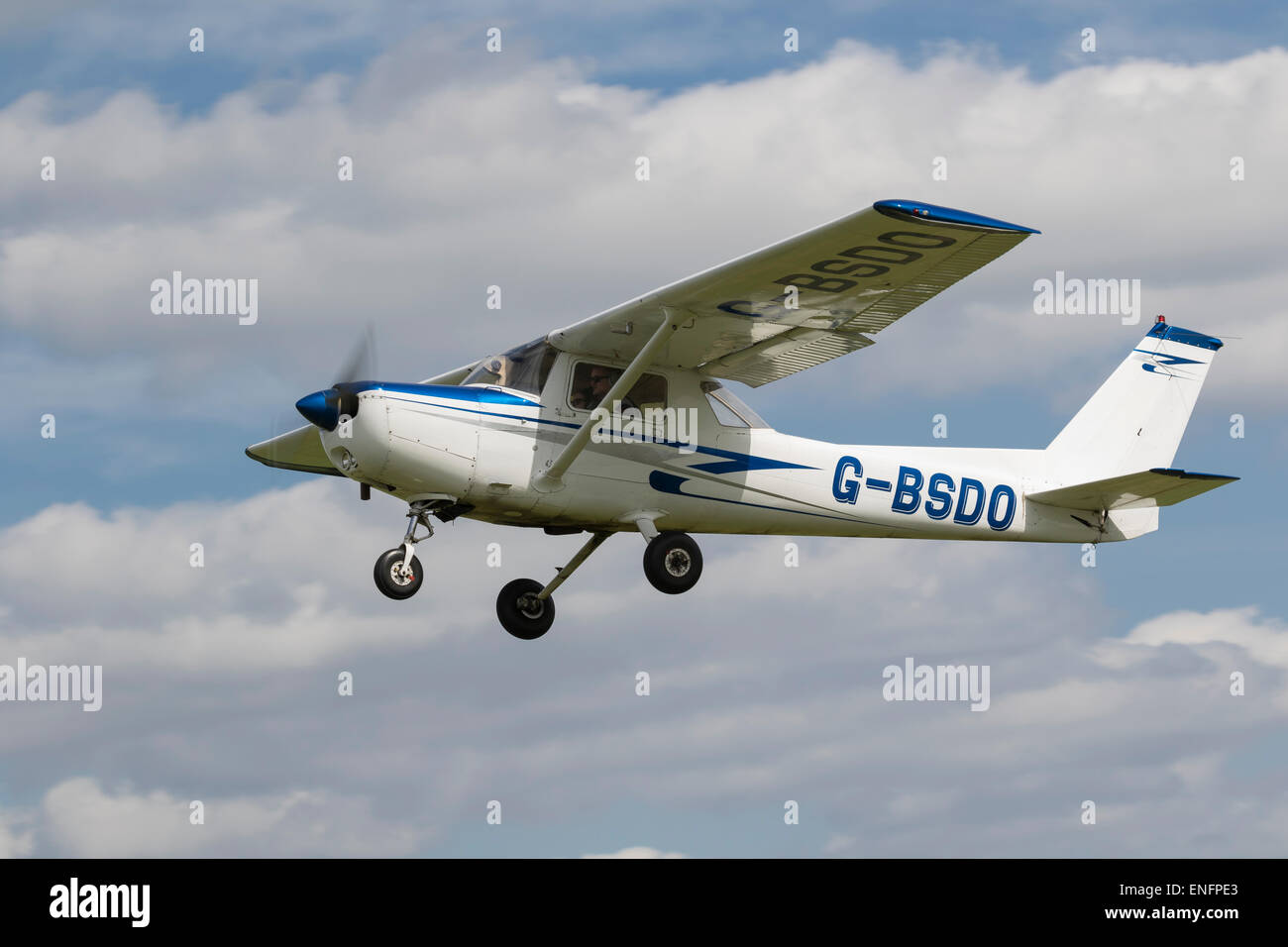 Cessna 152, built 1978, Registered G-BSDO, in flight at Breighton. Stock Photo