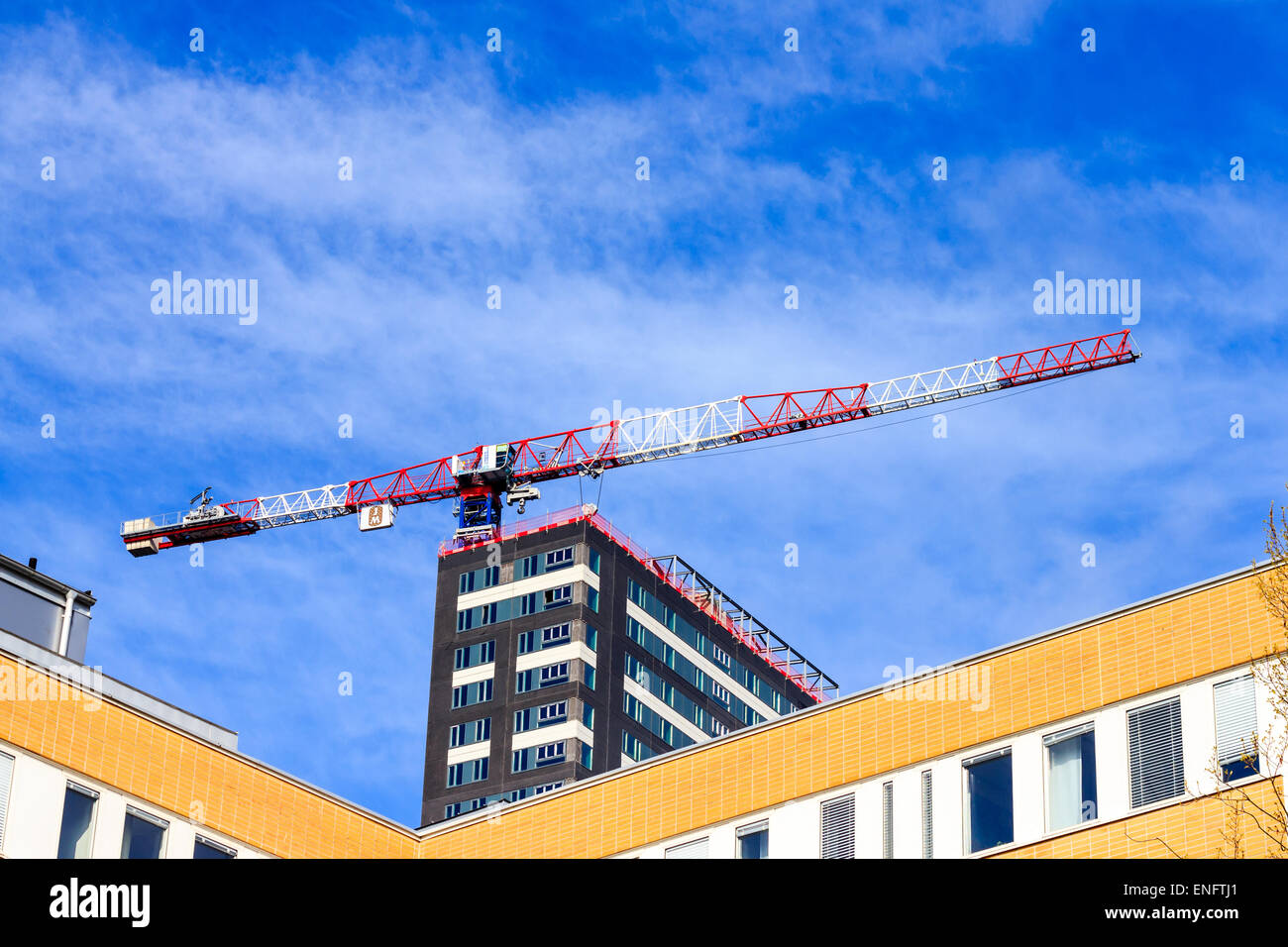 Concrete formwork and crane on construction site Stock Photo