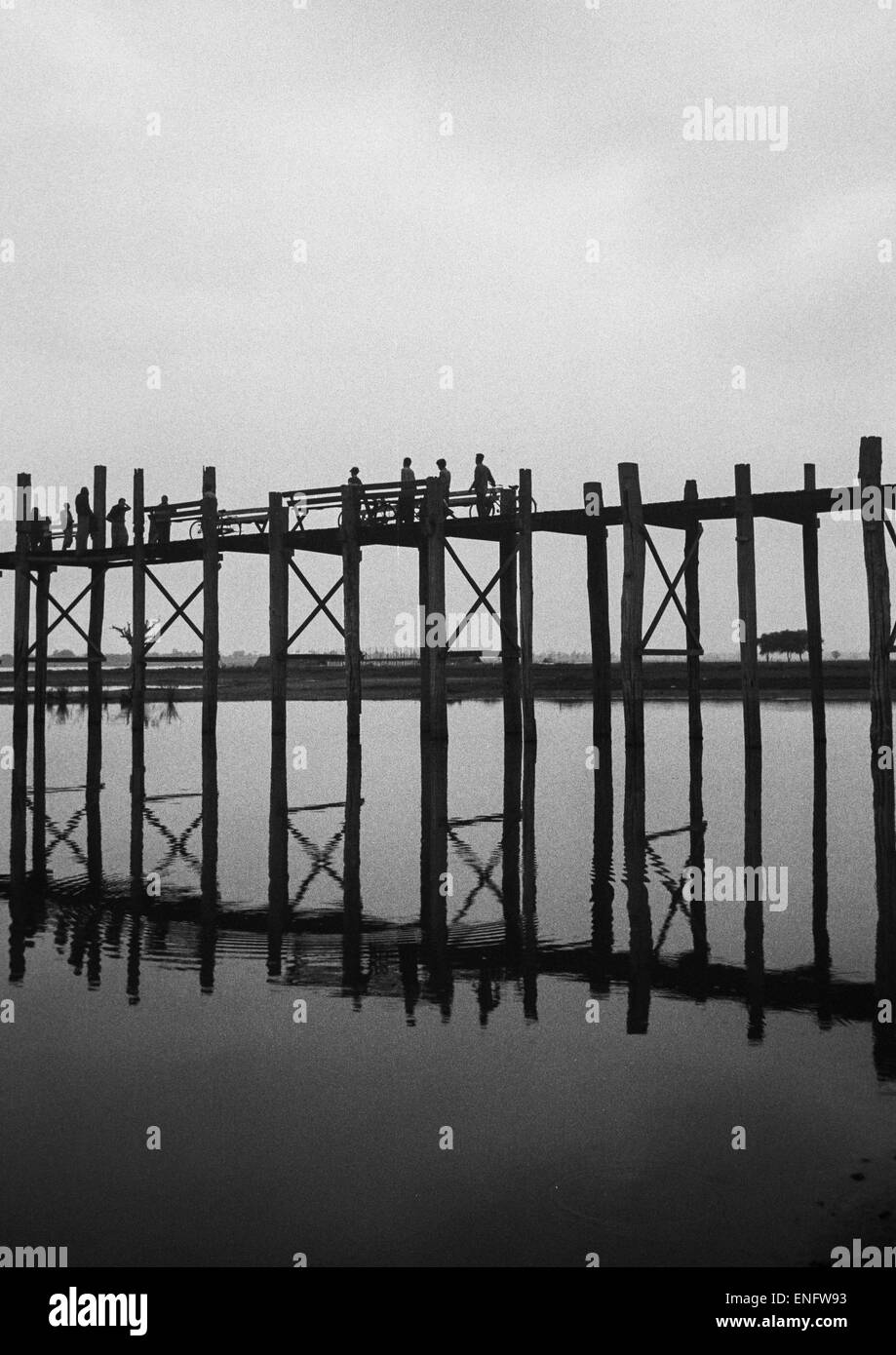 People Crossing U Bein Bridge In Amarapura, Mandalay, Myanmar Stock Photo