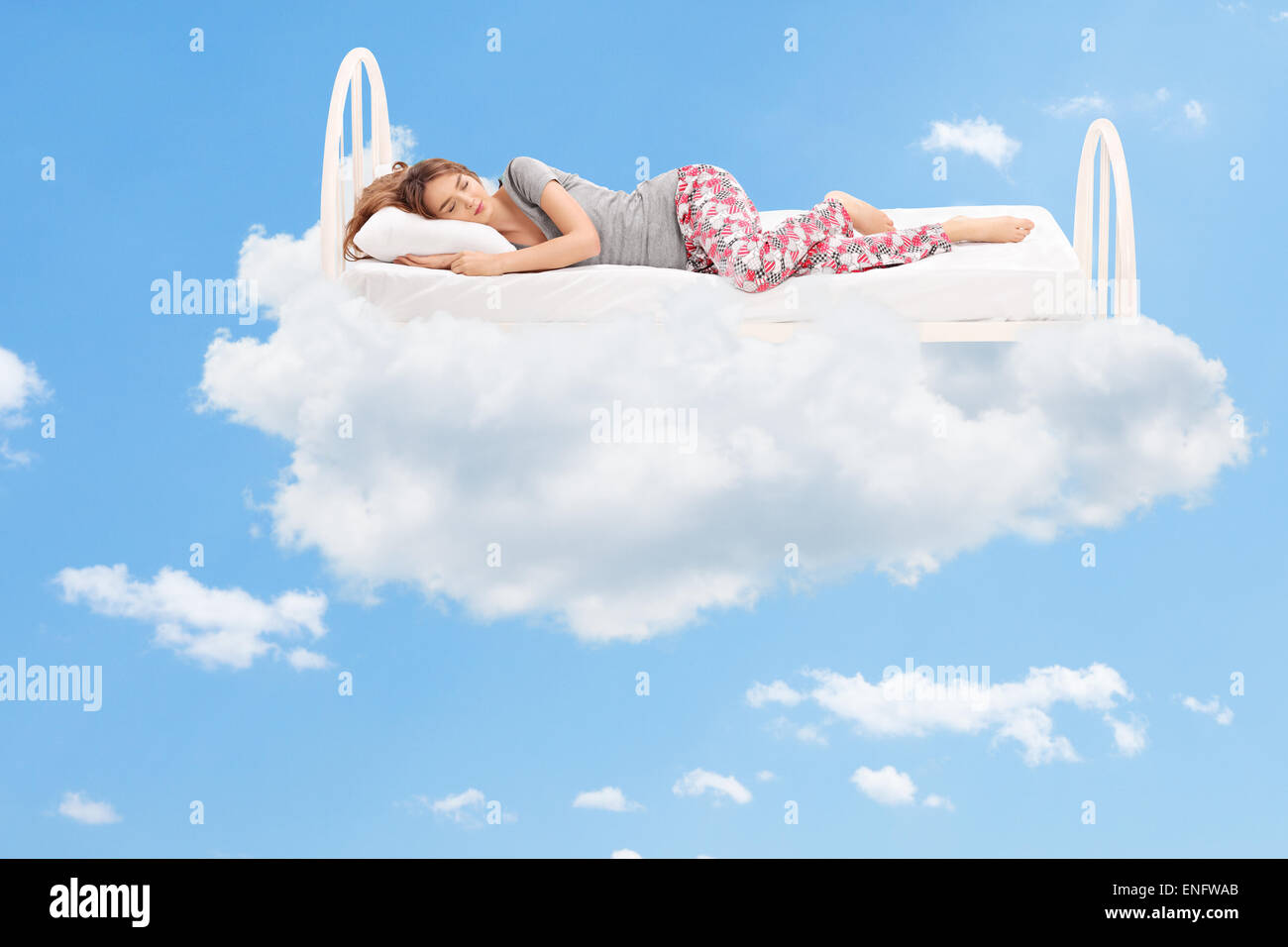 Asian Woman Sleep on Scatter Fake Cloud at Night Sky Time Stock