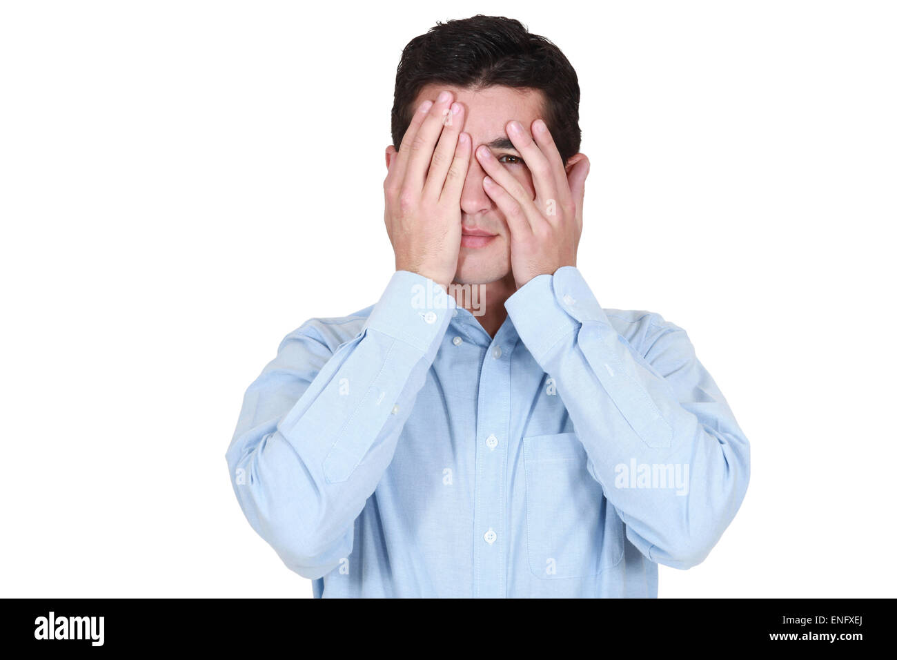 Man covering his eyes with his hands Stock Photo Alamy