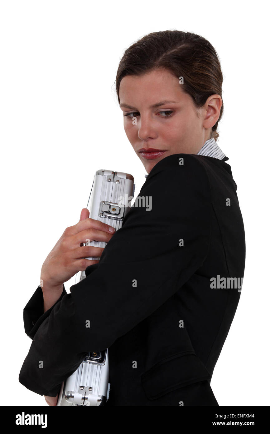 Woman clutching briefcase Stock Photo Alamy