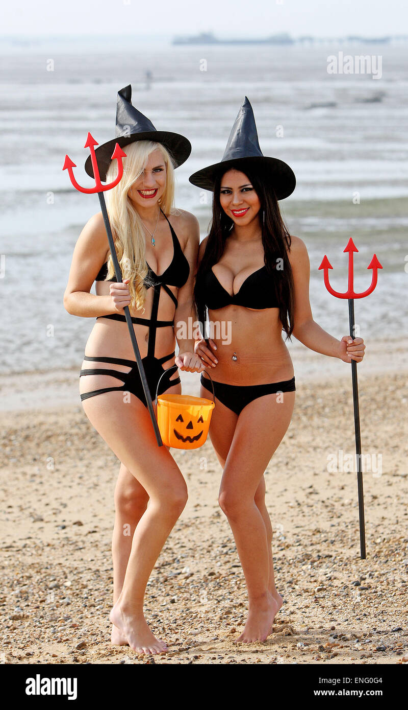 Dancers Sophie Lambert and Stephany Paredes pose together on Southend beach, wearing skimpy Halloween outfits.  Featuring: Sophie Lambert,Stephany Parades Where: Southend, United Kingdom When: 31 Oct 2014 Stock Photo