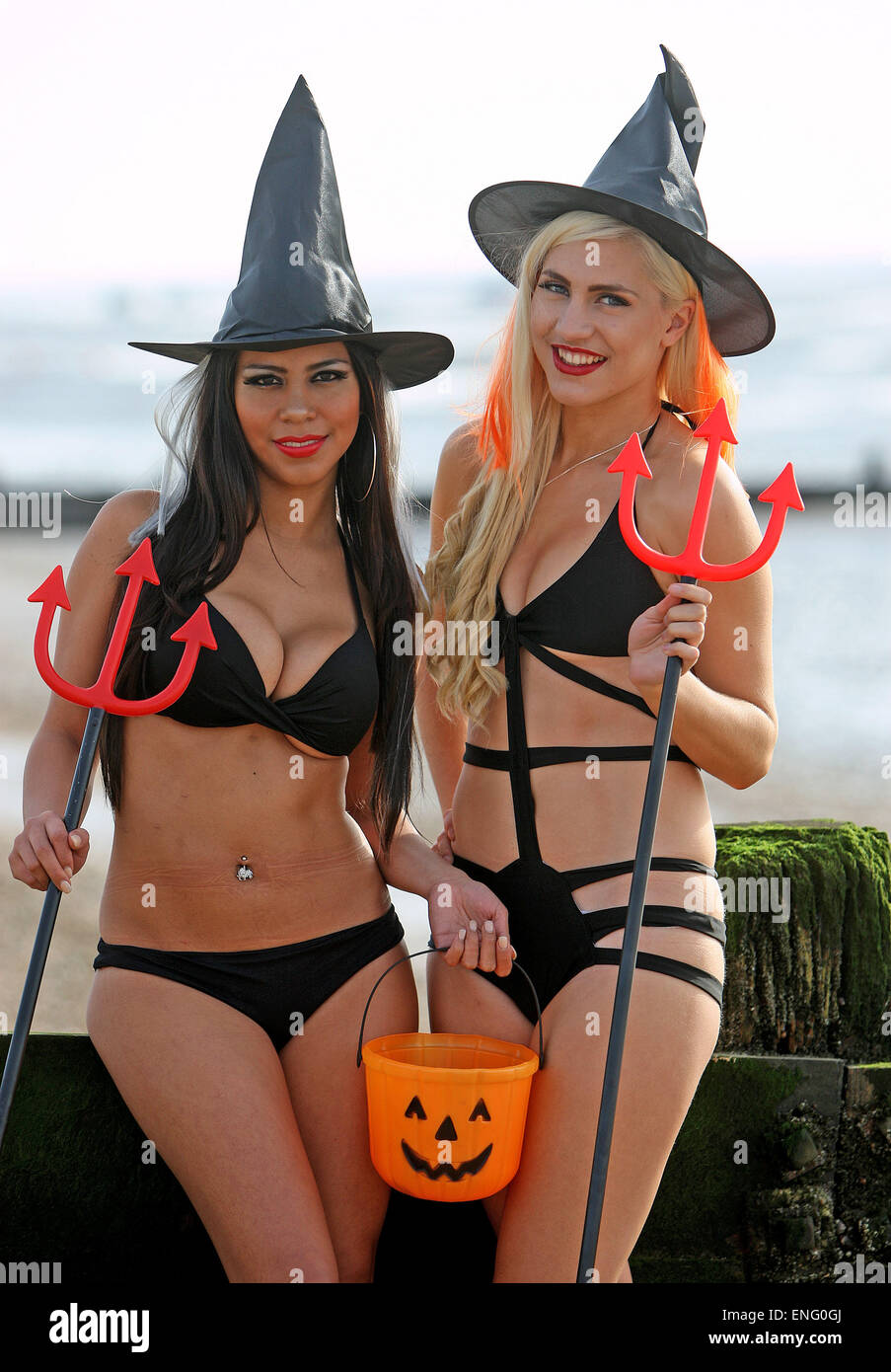 Dancers Sophie Lambert and Stephany Paredes pose together on Southend beach, wearing skimpy Halloween outfits.  Featuring: Stephany Paredes,Sophie Lambert Where: Southend, United Kingdom When: 31 Oct 2014 Stock Photo