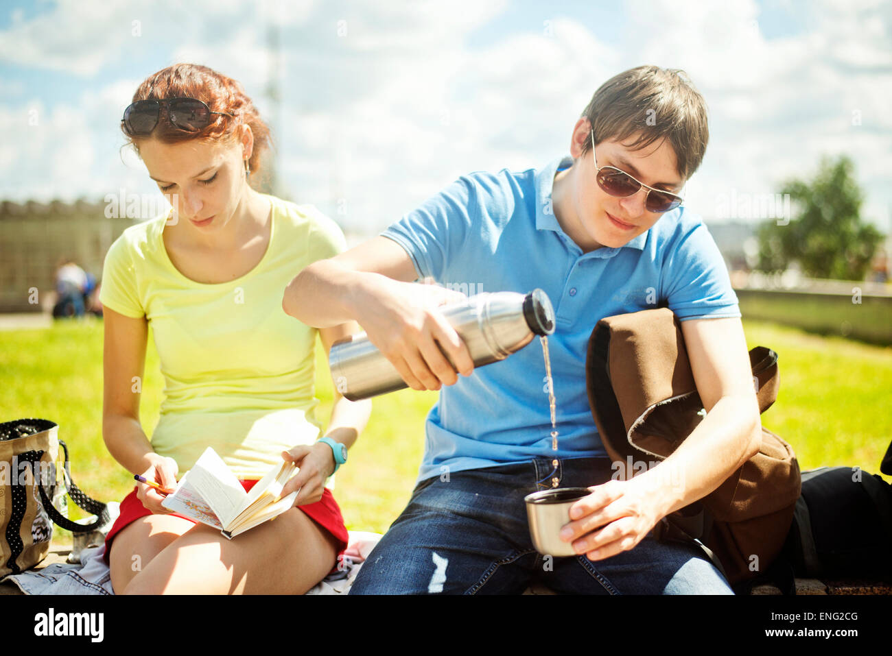 Caucasian couple relaxing in park Stock Photo