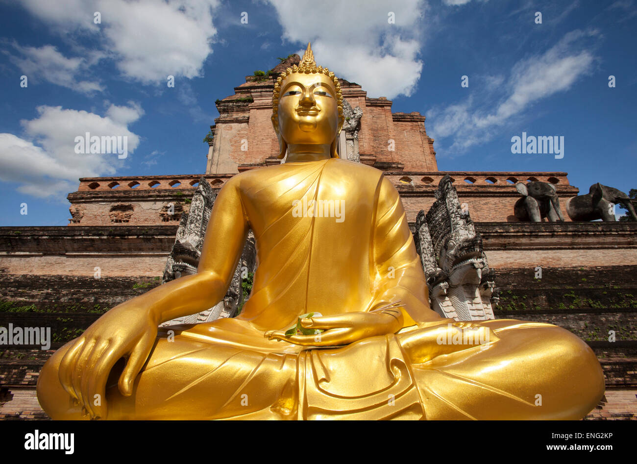 Low angle view of golden Buddha statue outside temple, Chiang Mai, Chiang Mai, Thailand Stock Photo