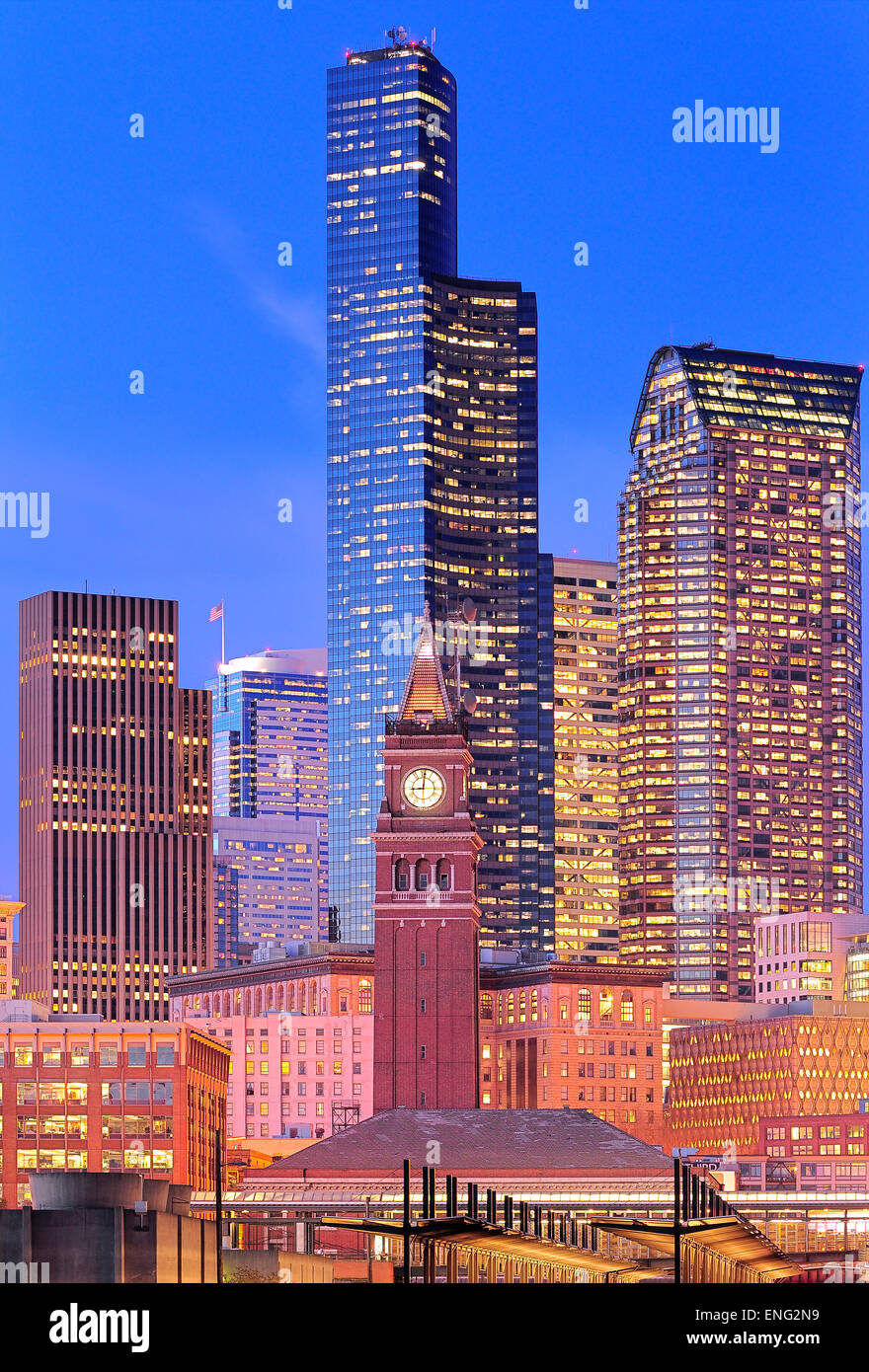 Clock tower and illuminated high rise buildings in Seattle city skyline, Washington, United States Stock Photo