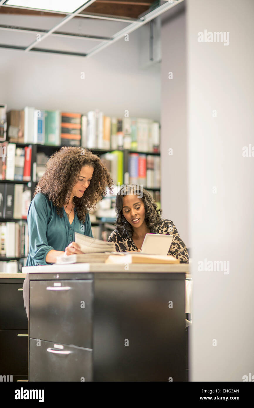 Businesswomen working together in office Stock Photo - Alamy