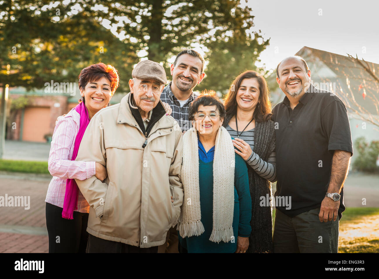 Multi-generation family smiling together outdoors Stock Photo