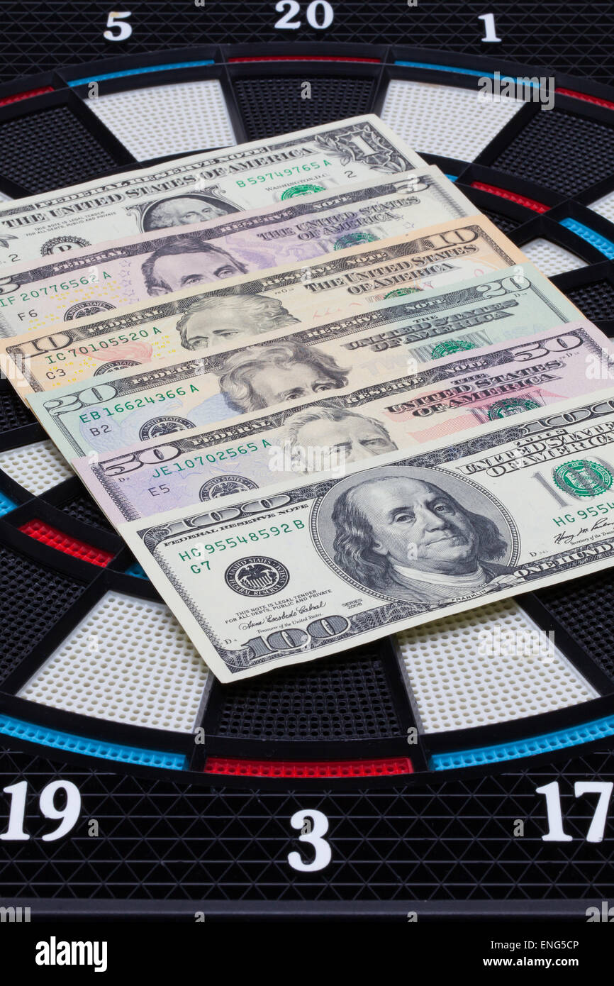 Detail dartboard with US dollar banknotes Stock Photo