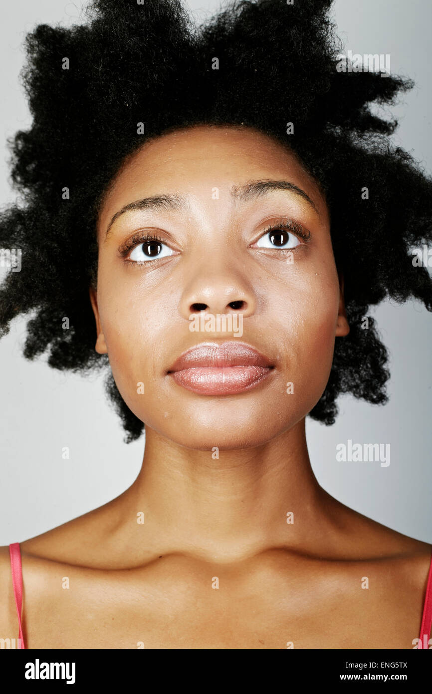 Close up of serious black woman looking up Stock Photo