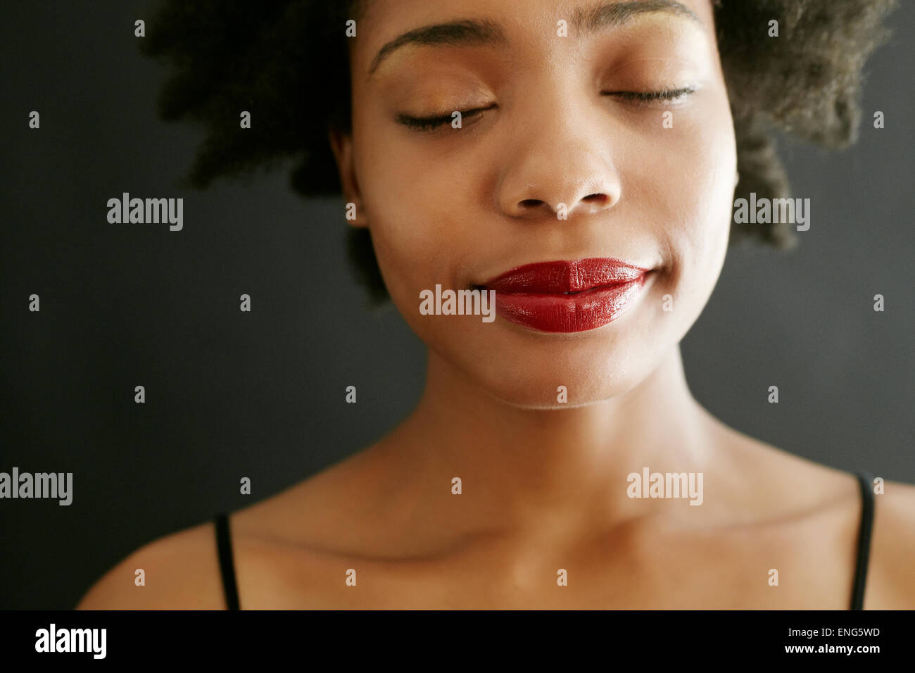 Close up of black woman with eyes closed Stock Photo