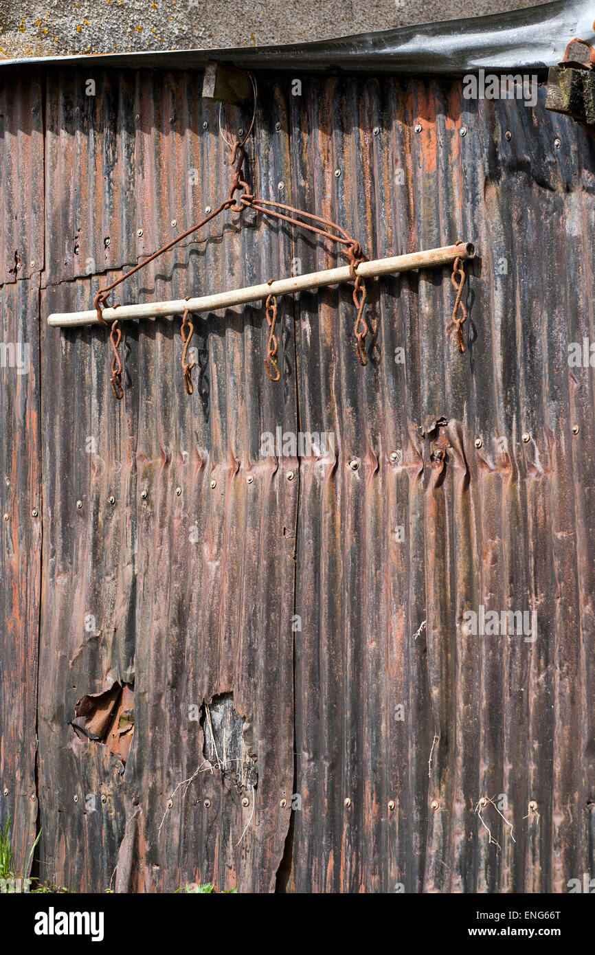 In agriculture, a harrow (often called a set of harrows in a plurale tantum sense) is an implement for breaking up and smoothing Stock Photo