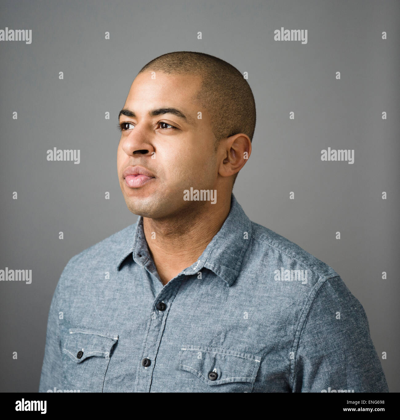 Close up of serious face of mixed race man Stock Photo