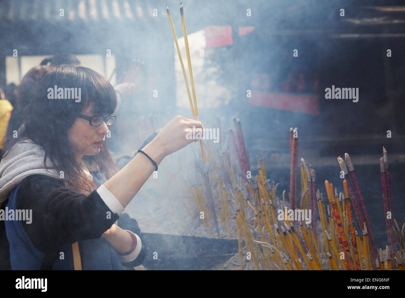 Burning incense sticks at Jiming Temple, a Buddhist temple in the city of Nanjing, in Jiangsu province, China. Stock Photo